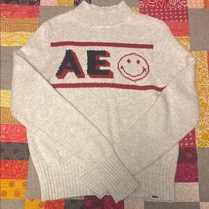 American Eagle Outfitters mock turtleneck Cream Sweater with Red & blue Design